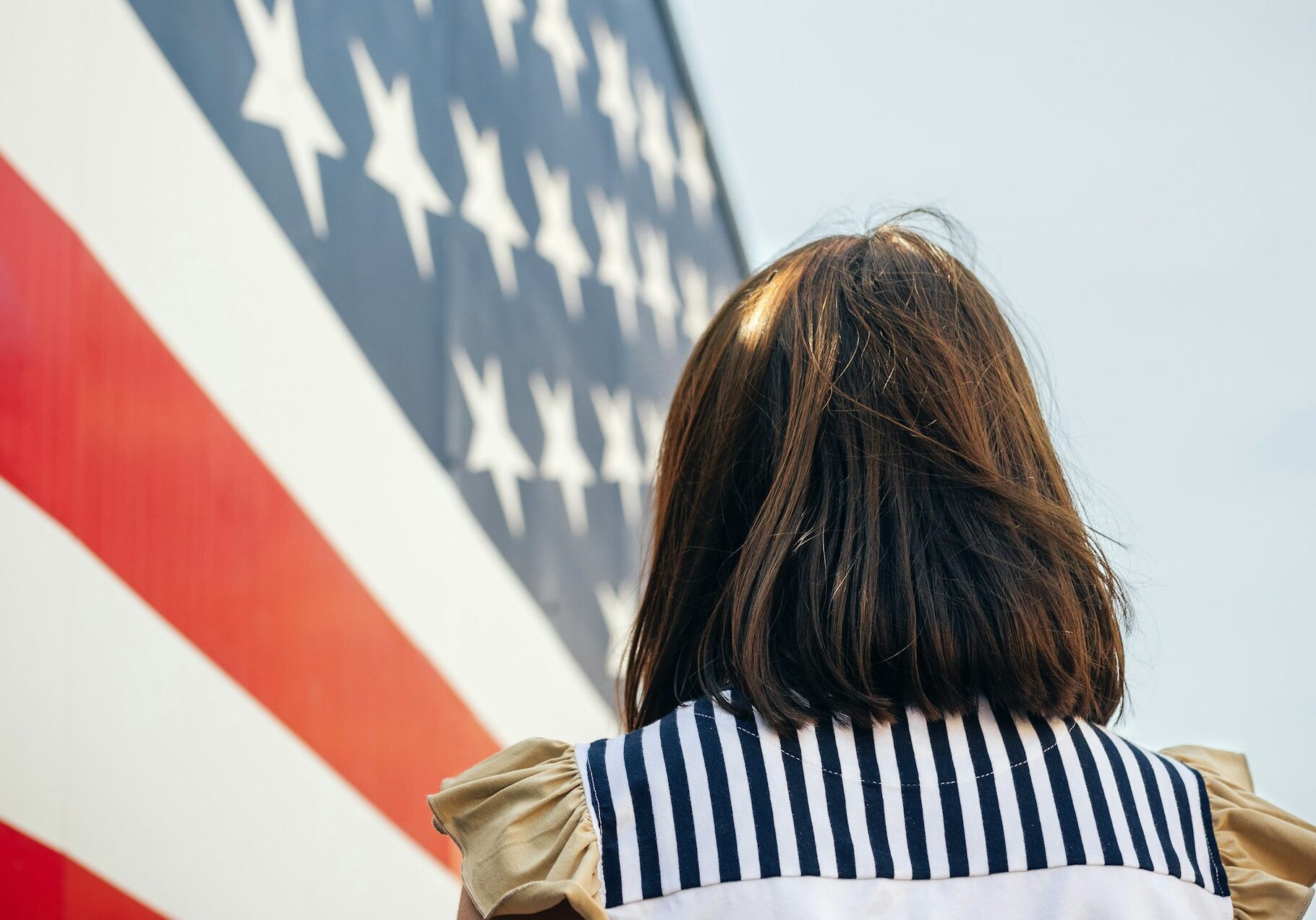 usa-back-view-of-woman-in-front-of-stars-and-stripes